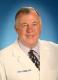 Dr John A Millin